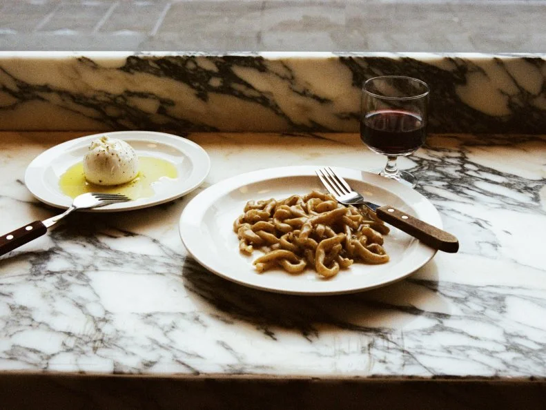 Padella's minimalist menu displays all the confidence of a nude model: No ornamentation is needed when your fresh pasta is this lithe and luscious. The lineup of dishes — which acts on cues from neighbouring Borough Market — is 10 million times shorter than the perma queue snaking outside. Don't worry: This smart little pasta bar zips through covers. A tangle of tagliatelle comes with rich nubs of chicken liver and mushroom; an antipasto of borlotti beans delivers salty kicks courtesy of salami chews; burrata bigger than a golf ball shines in a golden slick of Puglian olive oil. There's a diminutive room on street level, with seats spying on the chefs and the kitchen's glittering equipment; downstairs, a more roomy basement space awaits.