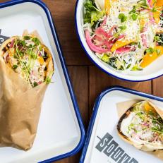The latest trend in San Francisco dining is fast-casual with counter service. Souvla has a short and sweet menu of Greek-inspired chicken, lamb and pork served over salads or in fluffy pita. The rotisserie ensures fresh and juicy meat, and housemade sauces are carefully chosen to go with each selection. There’s even a vegetarian option with white sweet potatoes. The food is fresh, succulent and never fussy. For dessert, frozen yogurt is served with a choice of sour cherry syrup, olive oil and salt, or baklava crumbles and honey syrup. In two locations, it is convenient and delicious enough to be a destination in its own right.