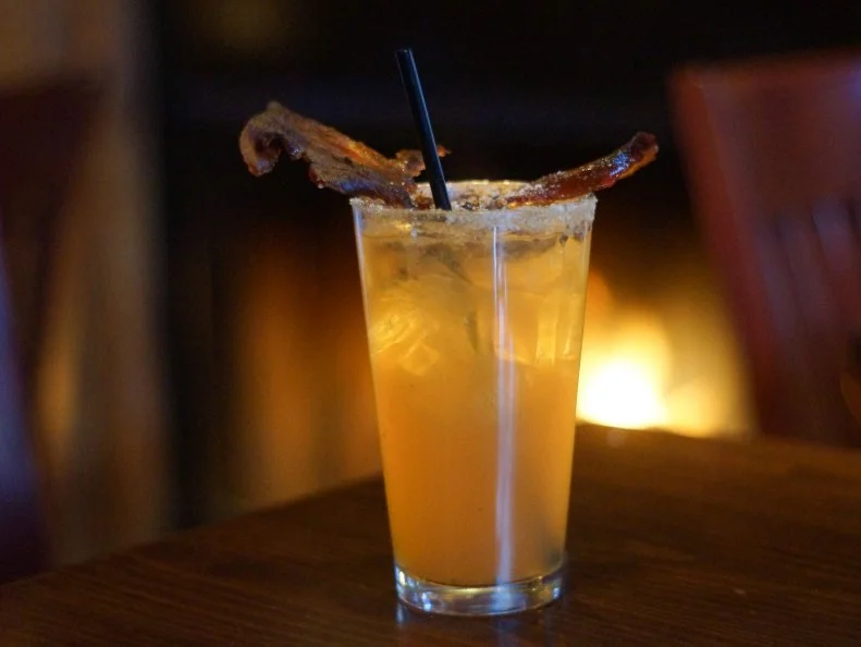 Sure, it’s five o’clock somewhere, but why wait? The first meal of the day is the perfect time to enjoy a Breakfast Bourbon at Devil’s Den, a South Philly gastropub and craft beer mecca. It’s especially appealing if ordered by the double-sided wood-burning fireplace. Kris Hagen’s savory brunch sip mixes bourbon with local maple syrup and apple cider, ginger beer and smoked sea salt, rimmed with hand-ground bacon salt and topped with a slice of crispy bacon. 