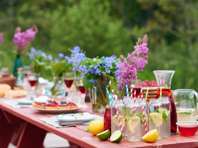 Festive table with food, drinks and flowers