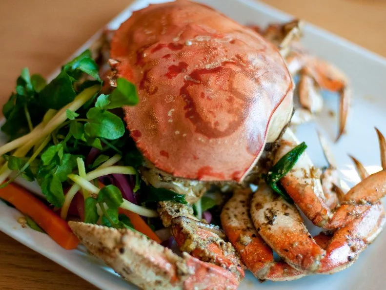 Monsoonâ  s owner, Sophie Banh, has been working with the same suppliers for the past two decades, and that includes Wong Tung seafood market in Seattleâ  s International District, where she sources her live crab. The Saigon-style Dungeness crab is made to order â   each crab is oil-blanched and finished off in the wok with shallots, garlic, butter, and five spice. This dish sells out immediately when itâ  s on the menu, which is only when Sophie gets a good deal on the crab. Even more rare is the fact that Sophie will not raise the price; she wants everyone to be able to afford to eat in her restaurant.