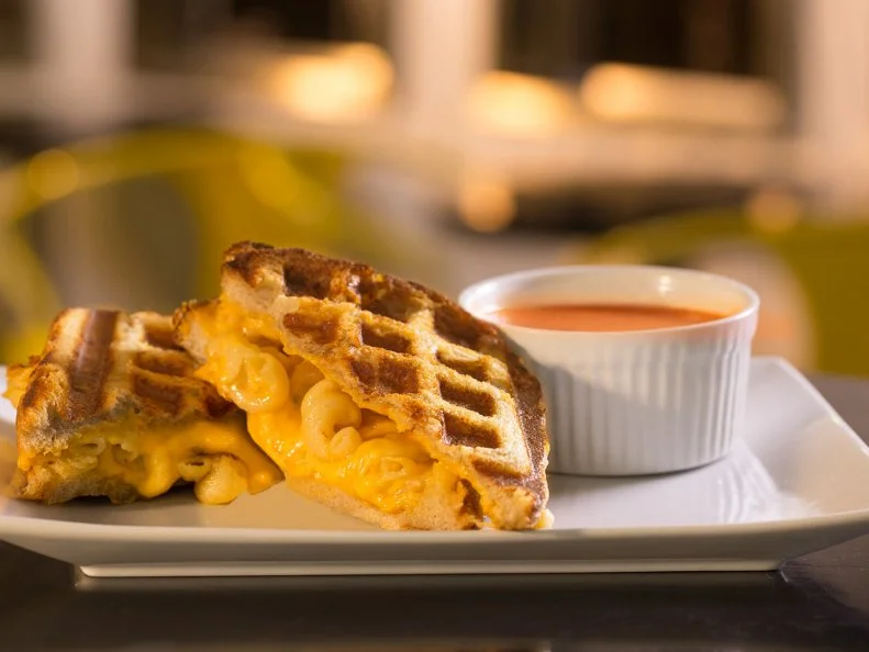 Open until the wee hours of the morning on the weekend, this sandwich shop has become a South Florida late-night favorite. Hordes of revelers fill the dining room, cheese often dripping from their mouths. While the namesake item is, obviously, the focus here, one menu item reigns supreme in the dairy and carb department, the Manhattan Grilled Mac + Cheese. A cheesy cavatappi pasta mac and cheese is smothered in a thick layer of American cheese and sandwiched by slices of buttery country loaf bread. The hand-held dish is then pressed on a waffle press, creating a wonderfully crisp exterior with plenty of crisp brown edges that hold all the cheesy goodness together.