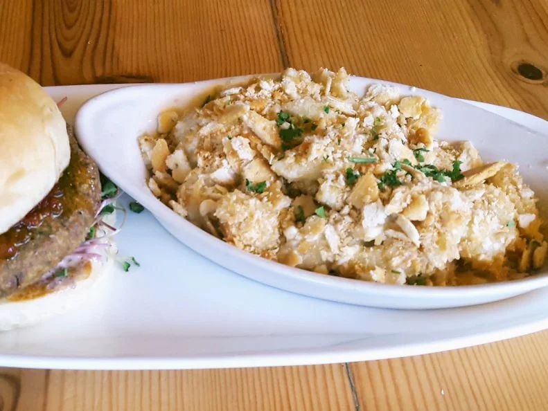 Few food items pair better with bourbon and barbecue than macaroni and cheese. Rounding out its selection of more than 250 whiskies and beers and oak-smoked, sustainable meats, this upscale St. Louis barbecue restaurant offers an equally ritzy — just wait — White Cheddar Cracker Mac. A traditional roux is loaded with white Cheddar and milk to produce a thick and rich cheese sauce. Pasta shells are tossed in the mix and baked in a pan with crushed Ritz crackers (get it now?) layered on top. Those classic, traditionally lowbrow crackers offer an extra buttery, salty crunch that's ideal for soaking up adult beverages while you're reminiscing about fond memories of childhood snacks.