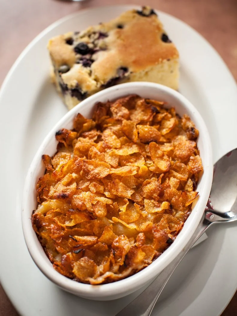 This three-floor, 100-year-old Rittenhouse Square pub is beloved by locals for many reasons: great music, a friendly staff, an extensive beer selection and creative American fare that's just plain good. Oh, and did we mention Good Dog Bar works with animal rescues? There’s a lot to like here, however, the baked macaroni and cheese is still at the top of the list. Elbow pasta is mixed with a blend of nutty Gruyère, aged Gouda, aged Cheddar and bechamel sauce in an oven-ready bowl, topped with corn flakes and baked to order. Because it’s not carb-loaded enough on its own, this mac and cheese is served with a hunk of blueberry cornbread on the side. He may not have tried the mac and cheese on his visit, but Guy Fieri said Executive Chef Jessica O’Donnell’s creative food’s on point.