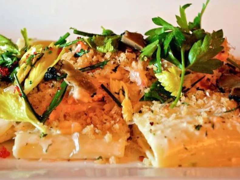 Bigger is most certainly better in the case of this unique mac and cheese. Instead of the typical elbow macaroni, significantly larger tubular paccheri noodles stand in. Each cylinder is about 1 1/2 inches long with about a half-inch diameter. Every piece is evenly painted with a thick coat of Taleggio fondue, a creamy sauce highlighting the mild and fruity tang of the washed rind Italian cheese. The cheesy pasta mix is piled onto a dish. The mound is then topped with Alaskan king crab and spicy breadcrumbs seasoned with celery seed, chili flakes and flecks of Maldon sea salt. It’s finished with a crown of chives, parsley and celery leaves gently tossed with fish roe, lemon juice and a touch of extra-virgin olive oil.