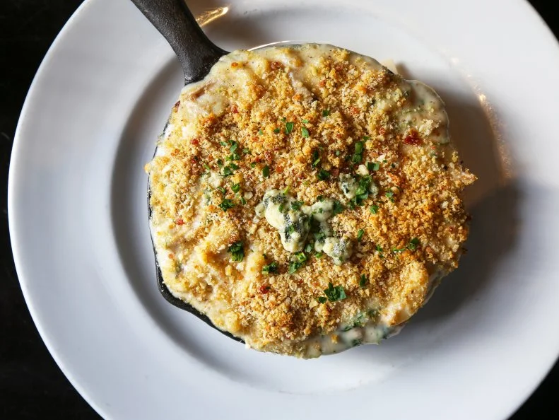 Chef Matt Gordon is hailed for fun takes on American classics at his North Park restaurant. A perfect example: Gordon’s Skillet of Duckaroni. In a play on boxed Pasta Roni, the chef mixes noodles with a cheesy mornay sauce scented with elevated ingredients like roasted garlic, blue cheese, scallions, arugula and fresh herbs. It’s creamy, tangy and cheesy with some fresh greens to lighten up the heavy ingredients. The real kicker, though, is the addition of succulent house-cured duck confit. Those bold ingredients are combined in a skillet, topped with bacon breadcrumbs (made from Urban Solace’s house Cheddar-chive biscuits), then baked to bubbly and rich perfection.