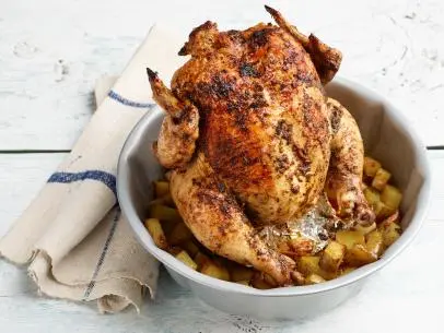 Food Network Kitchen’s Oven Roasted Bundt Pan Provencal Chicken with Roasted Potatoes for Food Network One-Offs, as seen on Food Network.