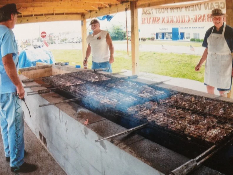 Travelers to the Delaware beaches from practically any point of the compass are liable to catch the wind-borne scent of smoky salvation (and salivation) as they near one of Delaware’s fund-raising chicken barbecue stands. A summer-long fixture, these temporary stands have been run for decades by such service groups as the Bridgeville Kiwanis Club, the American Legion in Dagsboro and the Ocean View VFW.