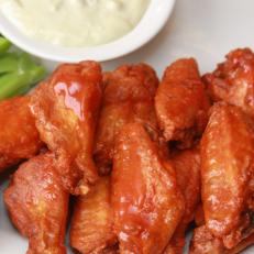 The favorite finger food of sports fans, Buffalo wings get their name from the city of their inception. There’s seemingly no such thing as a bad wing in Buffalo, but the establishment that rises above all others is the place where the wing was born. It started almost by accident as an experiment, on March 4, 1964. Anchor Bar co-founder Teressa Bellissimo’s son Dominic asked his mother to whip up a snack for his intoxicated friends late one night while he was tending bar. Teressa deep-fried the wings that were normally used as the base for stock, then flavored them with a secret sauce. While similar recipes have become mainstays on menus across the US, Teressa’s tightly guarded master recipe is only available at Anchor Bar.