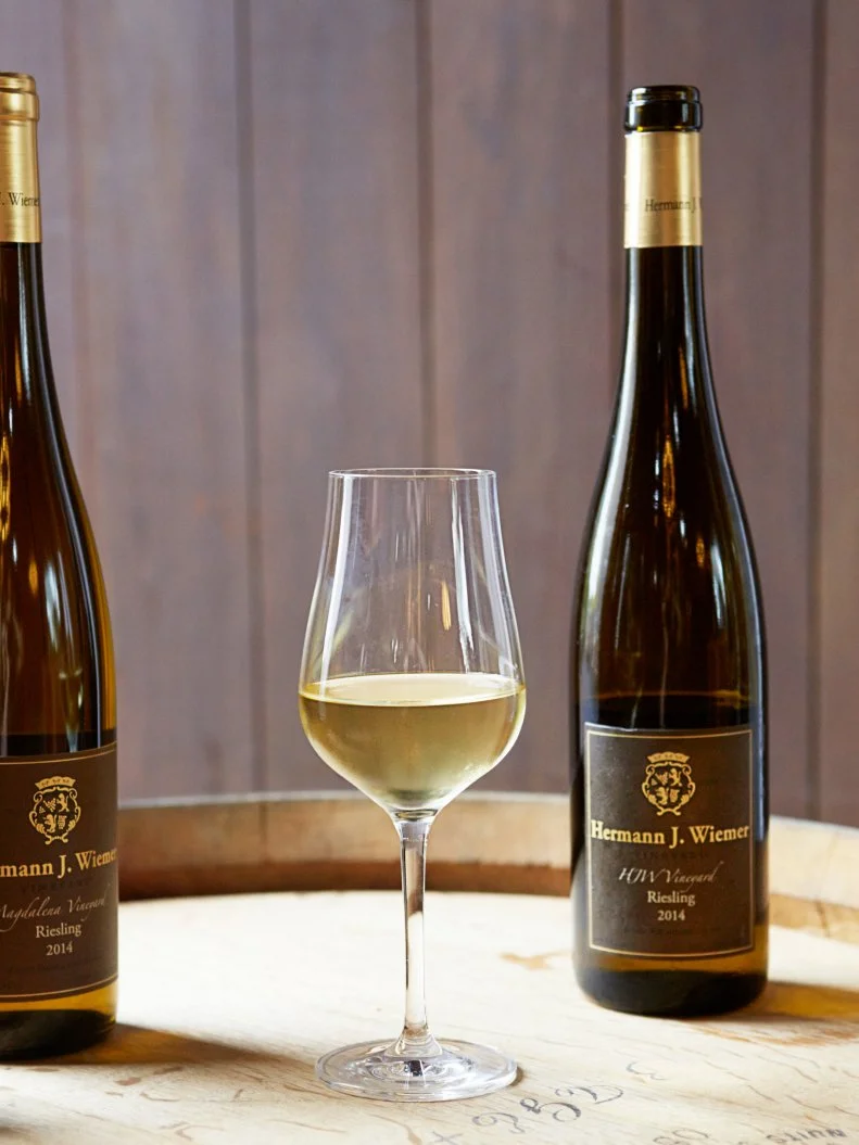 Grapes have been grown in New York state for centuries. For a long time, that fruit was better suited to jelly and grape juice, but wine-making pioneers grafted vinifera grapes onto American rootstock, and a wine industry was born. Hermann J. Wiemer is one of those early trailblazers who helped turn the Finger Lakes into a world-class region for Riesling, starting in the 1960s. Set on a hill overlooking Seneca Lake — the deepest of the district’s many glacial bodies of water — his eponymous winery sells a variety of Rieslings, each with unique flavor profiles derived from their contrasting soil and microclimates. The best-selling bottle is the signature Dry Riesling, a vibrant and aromatic bottle with crisp minerals.
