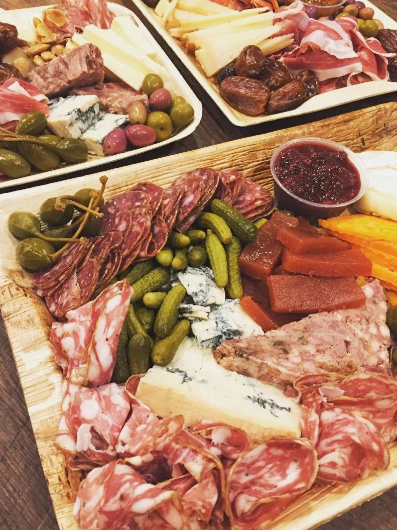 Since Chris Eley and his wife, Mollie, opened Goose the Market in 2007, the small meat market and specialty food shop has become known for its charcuterie. The demand was such that Eley expanded the operation to Smoking Goose â  meatery,â   which opened in 2011 and provides smoked and cured specialties like ham, bacon, salamis and sausages to restaurants and shops around the country. In addition to the meat counter, Goose the Market also has a downstairs enoteca, pairing the charcuterie with wine and beer.