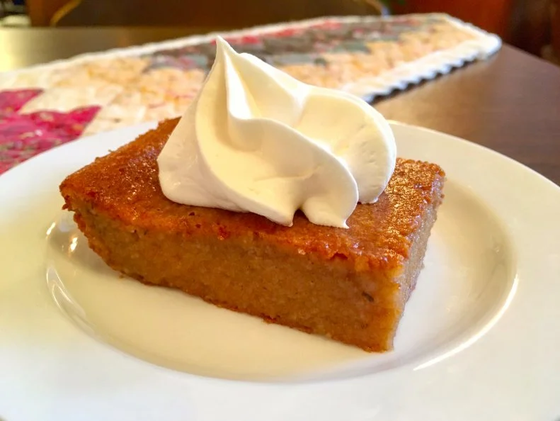 Persimmon pudding is actually more of a very moist cake than a creamy pudding. In Indiana, it’s typically made with the pulp of wild persimmons — which become squishy when ripe and fall from native trees in late autumn — rather than the firm Japanese persimmons found in supermarkets. Mitchell, Indiana, hosts an annual Persimmon Festival and is home to Spring Mill State Park, where the Inn serves the popular dessert in its Millstone Dining Room.