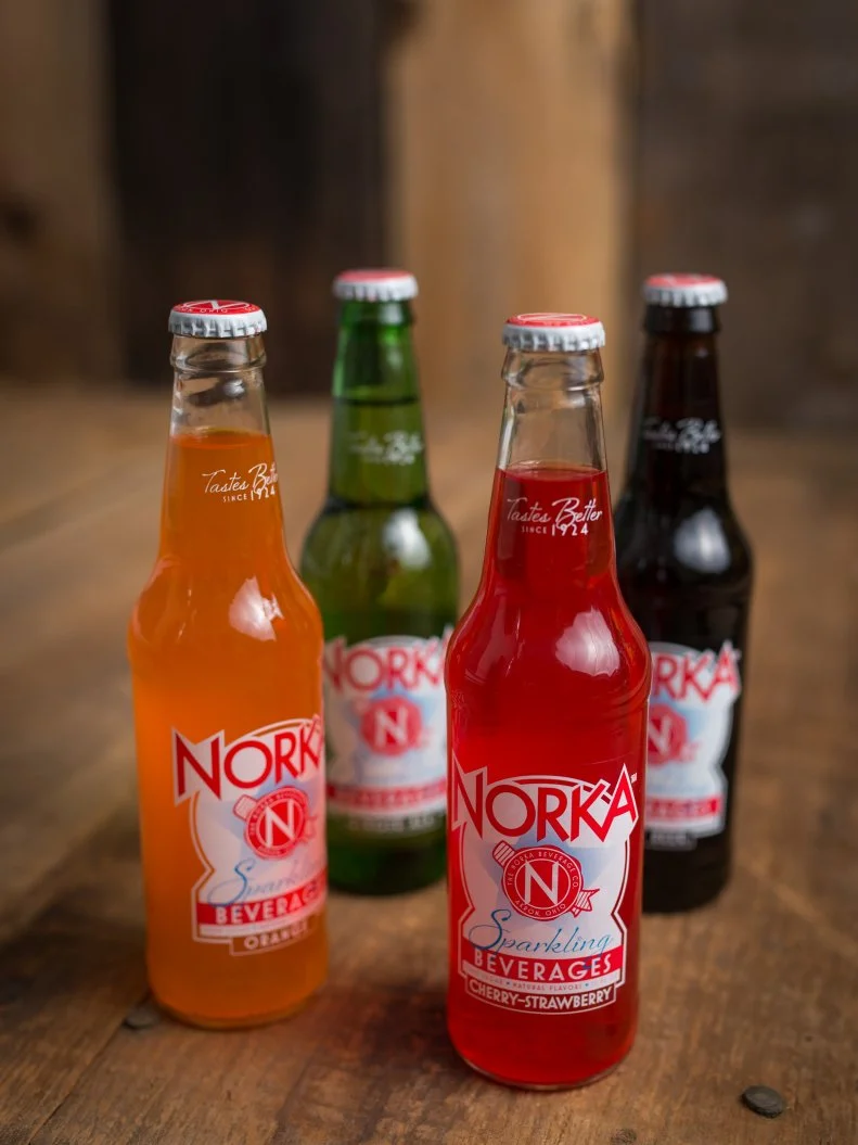 It used to be that every region had its own unique brand of soft drinks, including North Carolina’s refreshing Cheerwine and New England’s bracing Moxie. From 1924 to 1962, Akron had NORKA (Akron spelled backwards), a delicious line of hand-crafted beverages that, like most regional sodas, failed to survive as larger brands improved distribution. Revived a half a century later, the iconic NORKA brand is finding scores of new fans, thanks to flavors like Orange, Cherry-Strawberry, Ginger Ale and Root Beer. In fact, unlike the exclusively local footprint of its precursor, today’s NORKA can be purchased and enjoyed in multiple states and stores.