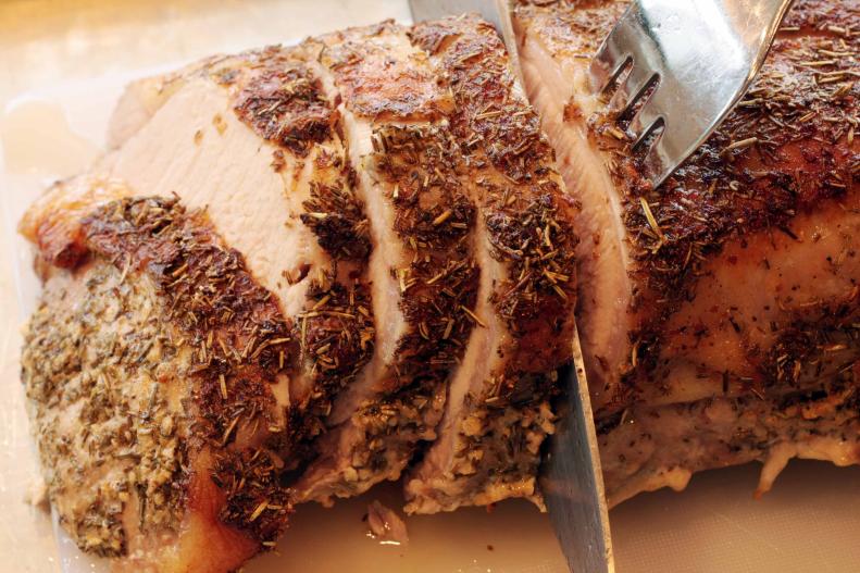 "Carving a tuscan pork roast.  Tuscan: rubbed with a mixture of garlic, salt, chrushed rosemary and olive oil before roasting.All images in this series..."