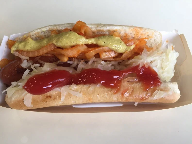 More than 500 million hot dogs have been sold since Nathan Handwerker, a Polish immigrant, first peddled his homemade frankfurters from a cart on the Coney Island boardwalk in 1916. Handwerker decided to undercut the competition by a whole 5 cents, which was pretty significant back when the going rate for a hot dog vendor was a whopping dime. Business grew enough that he soon opened his now-legendary stand on the corner of Stillwell and Surf, working with his his wife, Ida, 17 to 20 hours a day to sell the signature all-beef hot dogs. A century later, Handwerker's hot dogs can be found in supermarkets across the country, but it is much more satisfying to sit outdoors by the bright yellow stand and bite into a hot-off-the-grill snappy frankfurter — or two.