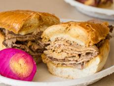 Fans of French dip sandwiches have Philippe Mathieu to thank. As the story goes, in 1918 Mathieu accidentally dropped a French roll into the roasting pan. The customer didn't mind the wet bun and today, neither does Wolfgang Puck, who likes his sandwich with horseradish mustard.