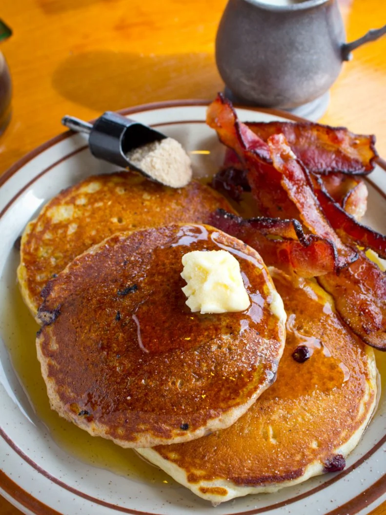 It stands to reason that a state with a serious maple syrup operation would put a high priority on pancakes. With views of the White Mountains and preserved historic properties including the home of Robert Frost, the town of Sugar Hill holds Pollyâ  s Pancake Parlor. Try the whole grain pancakes, which are made from freshly milled flours and served with the house maple syrup. Diners can mix batters (plain, whole wheat, buckwheat) and additions (coconut, ginger, blueberries) for endless combinations. Your server makes the cakes and delivers them in two rounds to make sure they are piping hot.
