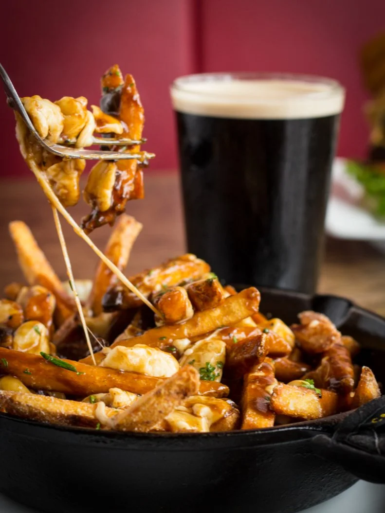 Natives with a strong French-Canadian heritage, especially near Manchester, carry a gravy-slathered torch for this iconic cheesy French fry combination. The dish is offered as a basic recipe in many bars around town, but at New England Tap House Grill in Hooksett, the fries are given a Parmesan and fresh rosemary dusting and the gravy is enriched with a sherry-peppercorn demiglace, then a heady spritz of truffle oil. Authentic: No. Worthy: Yes.