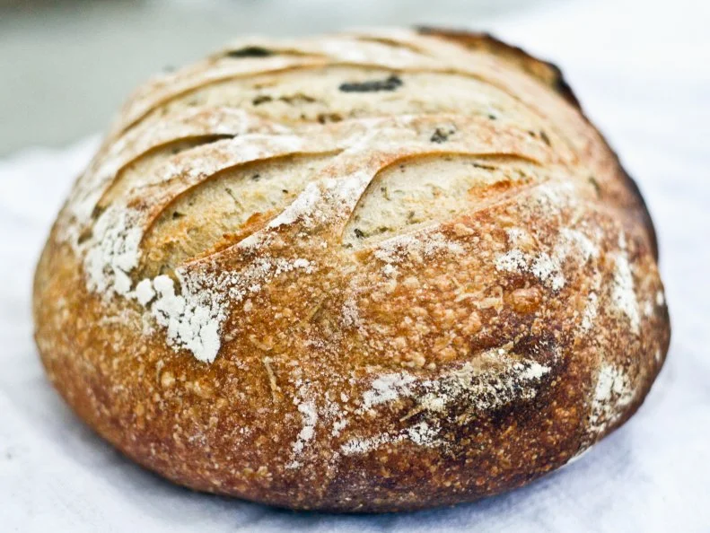 Blue Truck Bread is farmer-grown, farmer-ground and farmer-baked at Prairie Heritage Farm, a certified organic family farm owned by Jacob and Courtney Cowgill in Montana’s Golden Triangle. Using flour fresh-milled with Sonora heirloom wheat, Jacob crafts four types of sourdough bread to sell from the back of his 1963 Chevy Pickup at the Great Falls Farmers Market from June through September. His signature Papa Bread, named by the couple’s toddler who wakes up and shouts “Papa, bread!” from the top of the stairs, is rich and complex with a hint of sourness that doesn’t overpower the wheat’s earthy, nutty flavor.