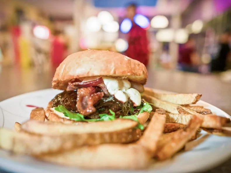 The menu at Burger Dive in downtown Billings lists seventeen types of burgers ranging from straight-up hamburgers to complexly layered items like the Blackened Sabbath Burger. Chef-Owner Brad Halsten offers rotating daily specials like the award-winning I’m Your Huckleberry, which won the 2016 World Food Championships title of World Burger Champion. Slathered with Halsten’s huckleberry-Hatch chile barbecue sauce, this 1/3-pound behemoth is topped with bacon and creamy goat cheese, roasted red pepper mayonnaise and arugula. Each patty is formed from never-frozen Angus beef and is served alongside fresh-cut fries or onion rings on a custom, locally made Grains of Montana bun.