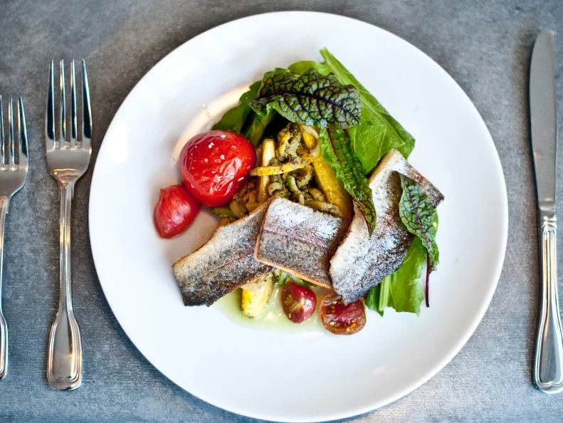 Because so many Montana anglers practice catch-and-release fishing, many head out to order trout, often from Ox Pasture in Red Lodge. Chef Chris Lockhart’s menu changes every two weeks from May through Thanksgiving, depending on what’s wild and fresh at the moment. The menu can showcase mushrooms in June or an autumn appetizer of duck confit on crispy fried chicken skin topped with crème fraîche and trout roe. Lockhart likes pairing naturally fed, hormone-free trout sourced from Trout Culture in Paradise Valley with things like zucchini spaghetti, carrot-top pesto and roasted tomatoes accompanied by Israeli couscous and roasted vegetables with crème fraîche.
