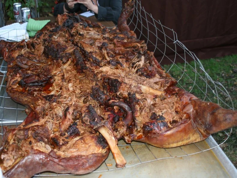 You don’t need much special equipment to smoke a whole hog, but few restaurants serve barbecue cooked using this primordial method, because it takes years to learn how to manage the fire, control the smoke and feel when the pig is ready to pull, and only the best of the best can pull it off. Scott’s-Parker’s BBQ in Lexington is among them. The barbecue joint cooks multiple hogs every day in simple cinderblock pits covered with sheets of cardboard to hold in the clouds of the smoldering hickory heat.