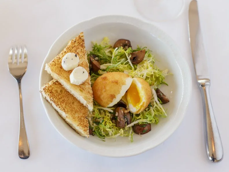 Tucked into the Frederick Law Olmstead-designed Lake Park with a wall of windows overlooking Lake Michigan, the aptly named Lake Park Bistro is the ideal spot for a respite. Channeling France, the lunch menu features bistro classics, including moules marinieres and a croque monsieur or madame, and classic French finales, including cheese plates and chocolate cake. This is the kind of place where you linger over French options from the wine list, including non-vintage Champagne or Brut RosÃ© from Alsace? James Beard Foundation Award-winning chef Adam Siegel oversees the menu as its executive chef.