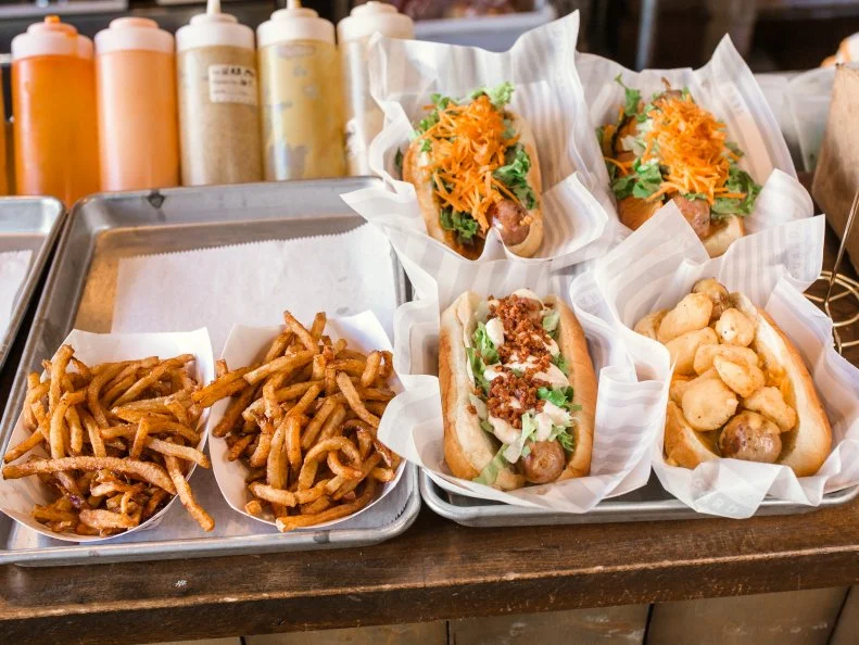 You expect a low-cost hot dog to taste like, well, a hot dog, right? That’s where Bay View’s Vanguard is different — and better. Customers order a wide mix of artisan sausages and dogs (mostly less than $7) at the counter and then dine communally either on the patio or inside, just steps from the kitchen. Specialty dogs include Hungarian sausage, jerk chicken, and the vegan Soy Meets World. Five varieties of poutine round out the meal. Vanguard is also known for its creative mixology; try The Cher Bear (with rosewater essence, vodka and violet liqueur) or the day’s “wild card” cocktail.
