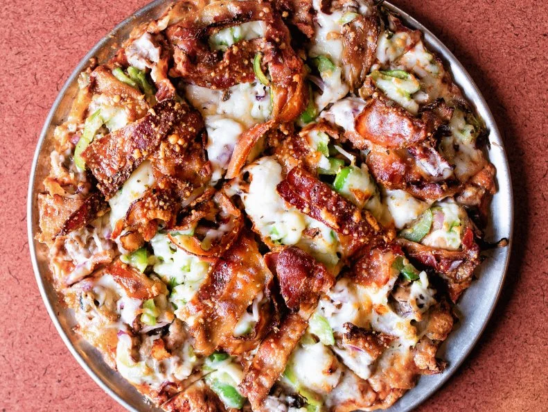 St. Louis-style pizza is kind of like the opposite of Neapolitan pizza: it’s got a cracker-thin, unleavened crust and it’s topped with Provel, a processed cheese. The pizza is almost always cut into squares, rather than slices, hence the slogan for Imo’s Pizza: The Square Beyond Compare. You simply cannot visit St. Louis without trying it, though. Pop into any Imo’s and go for the eight-inch lunch special. If you like it, you can always get more.