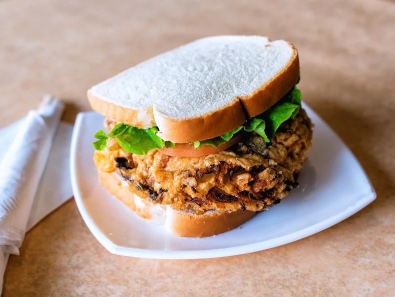 The St. Paul sandwich, which can only be found in St. Louis and not St. Paul, Minnesota, allegedly came from local Chinese restaurants looking to appeal to their American diners back in the 1940a. The sandwich tops a fried egg foo young patty with lettuce, tomato, pickles and mayo, all sandwiched between two pieces of white bread. Mai Lee’s “Special” St. Paul has a mix of proteins in the patty for an added dimension of flavor.