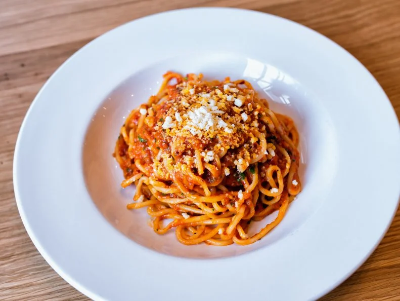 The Hill in St. Louis was once known as a Midwestern mecca for Italian-American food. Times have changed and the city has moved on from red and white sauce, but the Italian heritage still remains, as does a love for pasta. Pastaria’s bucatini all’amatriciana is a modern classic: house-made bucatini noodles are tossed in a sauce made with San Marzano tomatoes, red onion, some chile for heat, and subtly smoky guanciale. Grana Padano finishes it off.