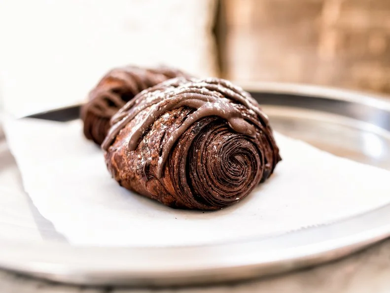 Considering the French origins of the name St. Louis, the city owes it to its people to have some better-than-average pastries. The Darkness Croissant at La Patisserie Chouquette is the perfect balance of butter and chocolate, good and evil. The bakery starts by making a chocolate butter — yes, that exists — then creating a labor-intensive chocolate laminated dough. The dough is filled with two dark-chocolate batons (one is never enough), then, once baked, laden with ribbons of melted dark chocolate and a sprinkling of pink Himalayan sea salt. Consider your chocolate cravings satisfied with this cacao grenade.