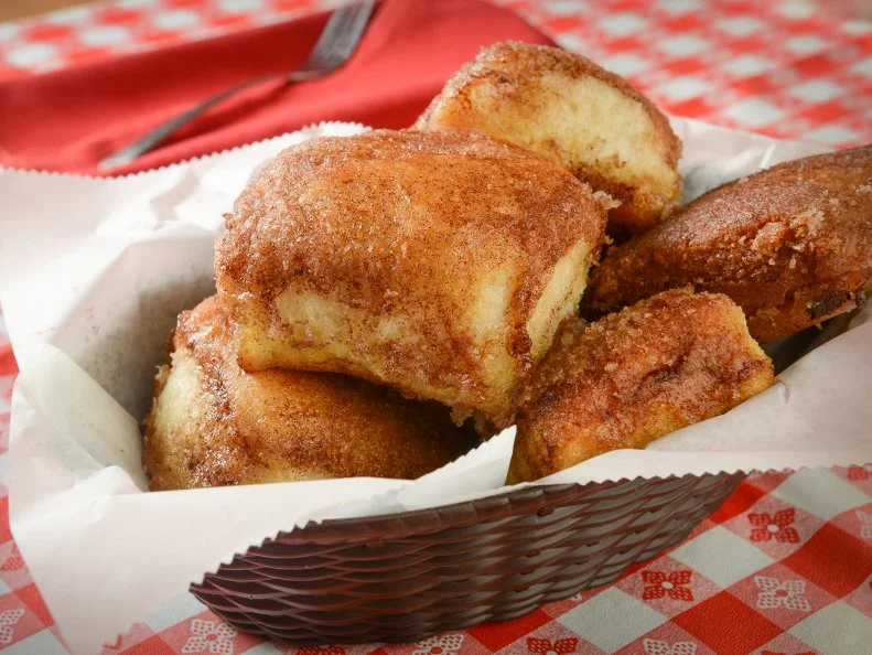 Stroud’s is known for two things: pan-fried chicken and the cinnamon rolls that come with them. These aren’t your normal cinnamon rolls, either. These are somewhere between biscuits and a dinner roll, rolled in a mix of cinnamon and sugar just as they come out of the oven, piping hot. With the sweet cinnamon topping, yeasty bread in the middle, and buttery bottom, the rolls are practically guaranteed to disappear in no time. Those in the know order a dozen to-go, knowing they’re going to want more.