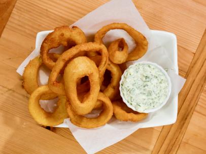 Ranch dip goes perfectly with onion rings, as seen on Food Network's The Kitchen.