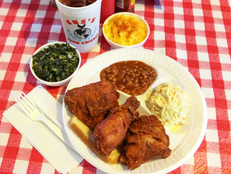 If you go to Gus’s for anything but fried chicken, you’ll likely soon change your mind. Napoleon “Na” Vanderbilt’s fried chicken was well-known to the citizens of Mason, Tennessee: With local support, Na constructed and opened the first restaurant, Maggie’s Short Orders, in 1973. Na’s son, Vernon “Gus” Bonner, inherited the recipe and the restaurant. Family friend and Memphian Wendy McCrory brought the restaurant’s distinctive flavors to Memphis in 2001. Get your chicken with beans and greens and other things, but expect a line, especially when nearby Beale Street is hoppin’.
