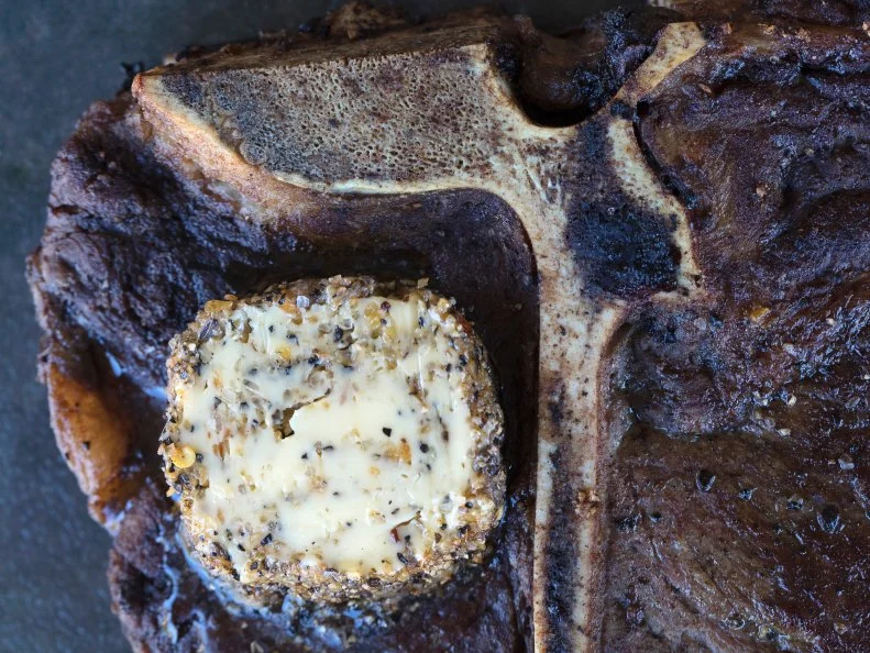 T-bone steak with compound butter, food photography by Jackie Alpers for FoodNetwork.com