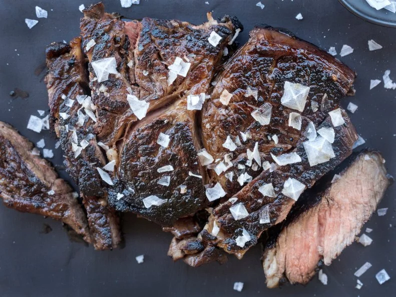 sliced pan seared steak with Maldon sea salt as an accent. Food photography by Jackie Alpers for FoodNetwork.com