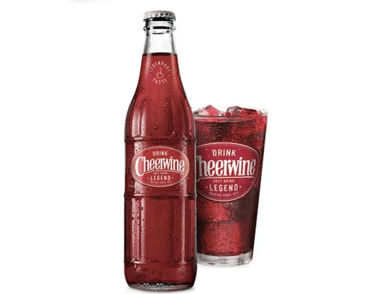 Cheerwineâ  s motto is â  Born in the South, Raised in a Glass.â   The bubbly, cherry-flavored cola was invented in 1917, and received the gift of distribution outside the Carolinas for its centennial. Thereâ  s no alcohol in it; the â  wineâ   refers to the garnet color. Audaciously proclaiming itself the perfect beverage to accompany the Southâ  s most revered dish â   barbecue â   the company now markets its own barbecue sauce. Even better, add the soda to genuine Cheerwine ice cream to create a float with a double dose of that unique flavor.