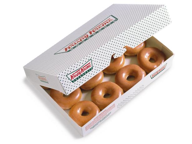 When the red neon â  Hot Nowâ   sign beckons from the highway, few drivers can resist the pull of Krispy Kreme. Though itâ  s now an international sensation, the doughnut chain got its start in Old Salem, North Carolina. Inside the store, delicious doughnuts arrive, fresh off.