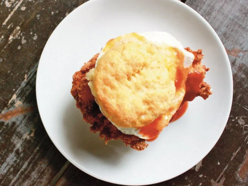 There’s no need to wonder which came first: Both the chicken and the egg take center stage in this breakfast sandwich. Every morning, Chef Hugh Acheson and his Empire State South crew crank out legendary chicken biscuits for adoring Atlantans. Airy, buttery biscuits surround a scrambled egg and a tender batter-fried breast sourced from nearby Grateful Pastures in Mansfield, Georgia. Those fillings alone would make for one delicious brekkie, but Acheson and his crew just keep laying on the Southern flavor. They add sweet and savory bacon marmalade and creamy pimento cheese to kick it up an extra couple of notches. Talk about a hearty start to the day.
