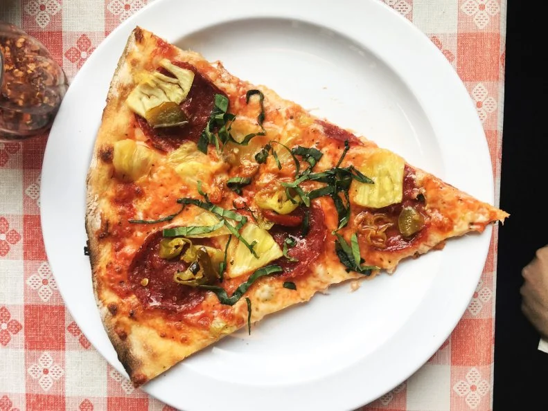 If a punk rock band opened a pizza parlor in a 1980s basement, it would look like Portland sandwich king Tommy Habetz’s Pizza Jerk, which seems devil-may-care, but makes seriously good pies. The “It’s Always Sunny in Cully,” named after the surrounding neighborhood, is topped with pepperoni from the butcher across the street. If your party’s large enough, order that plus a 12-inch thick-crust cast-iron pie. Either way, finish with a no-frills soft serve (free on Tuesdays!).