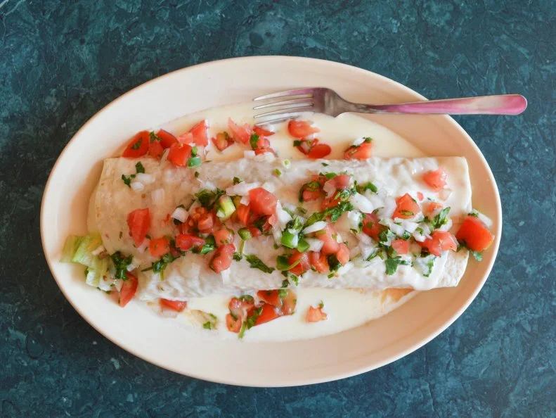 Many Mexican immigrants have made Kansas their home, which also means there are a lot of local restaurants featuring family recipes brought to the state. In downtown Topeka, Lupita’s Monster Burrito is a perfect example. A 10-inch tortilla is packed with rice, beans and diners’ choice of meat, all made from family recipes the founding owner used when the restaurant opened more than 20 years ago. Lettuce, tomatoes, cheese and sour cream are also wrapped inside before the whole thing is topped with a queso sauce. Be sure to ask for pico de gallo on top.