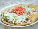 Fried Bread Taco as served at Pueblo Harvest Café in Albuquerque, New Mexico as seen on Food Network's Guy's Family Road Trip episode FY0102H: Wild West Canyons and Cookouts.