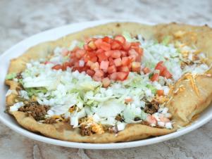 Fried Bread Taco as served at Pueblo Harvest Café in Albuquerque, New Mexico as seen on Food Network's Guy's Family Road Trip episode FY0102H: Wild West Canyons and Cookouts.