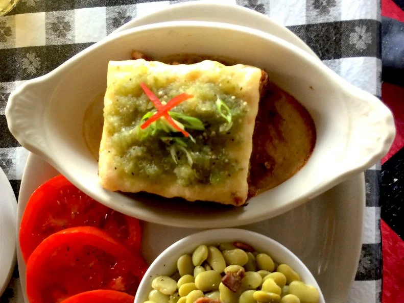 Given this state’s obsession with hot tamales, you might expect a casserole that captures those textures and flavors for a fraction of the labor would also take off. Most of the versions of tamale pie that turn up in old community cookbooks feature layers of cornbread batter and chili. Some Mississippi cafés have their own takes. At Ajax Diner, a meat-and-three on Oxford’s square that’s a hit with the university crowd, proprietor Randy Yates enriches locally ground Grit Girl grits with cheese and layers the mixture with smoked pork, green chiles, tomatoes and corn — a change of pace from the more predictable meaty entrees that come with classic plate-lunch vegetable sides.
