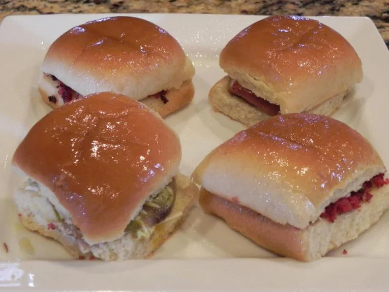 Adventurous eaters often make pilgrimages to The Big Apple Inn on Jackson’s historic Farish Street to sample a pig ear sandwich. The first batch came about when a butcher gave pig parts he wasn’t using to the cafe’s first proprietor, Juan “Big John” Mora, a Mexican who began selling tamales on Jackson street corners in the 1930s. Today, his great-grandson, Geno Lee, carries on this thrifty tradition, cooking the ears until tender (but still undeniably chewy) and serving them on soft, square buns with slaw, mustard and homemade hot sauce. Anthony Bourdain bit into one, as did Andrew Zimmern. Both raved about the house specialties, as well as the ground smoked sausage sandwiches, or “smokes.”