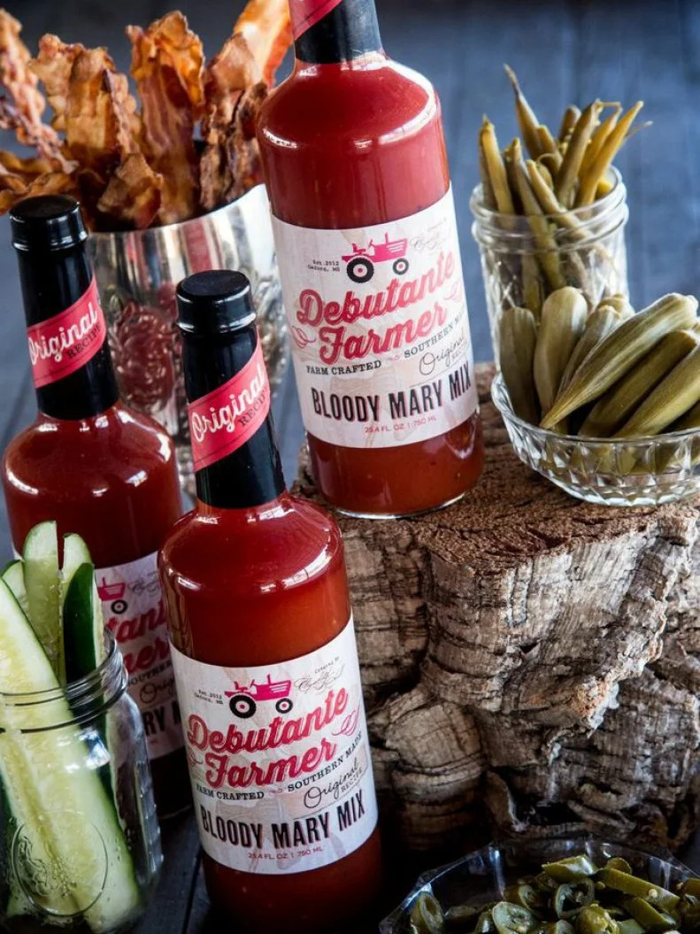 Mississippians may like their bourbon neat, but when it comes to mixing Bloody Marys, there's no end to embellishments. Elizabeth Heiskell, an Oxford-based caterer, cookbook author and culinary personality, uses ripe tomatoes from her farm to make Debutante Farmer Bloody Mary Mix, which is sold throughout the state. When preparing a batch, she invites guests to garnish with olives, pickled okra, jalapenos, bacon strips and whatever else she sets out. Fresh lime juice and Tabasco add zip to her all-natural mix. To add an extra dose of state spirit, pair it with Cathead Vodka, produced at Mississippi's first legal distillery.