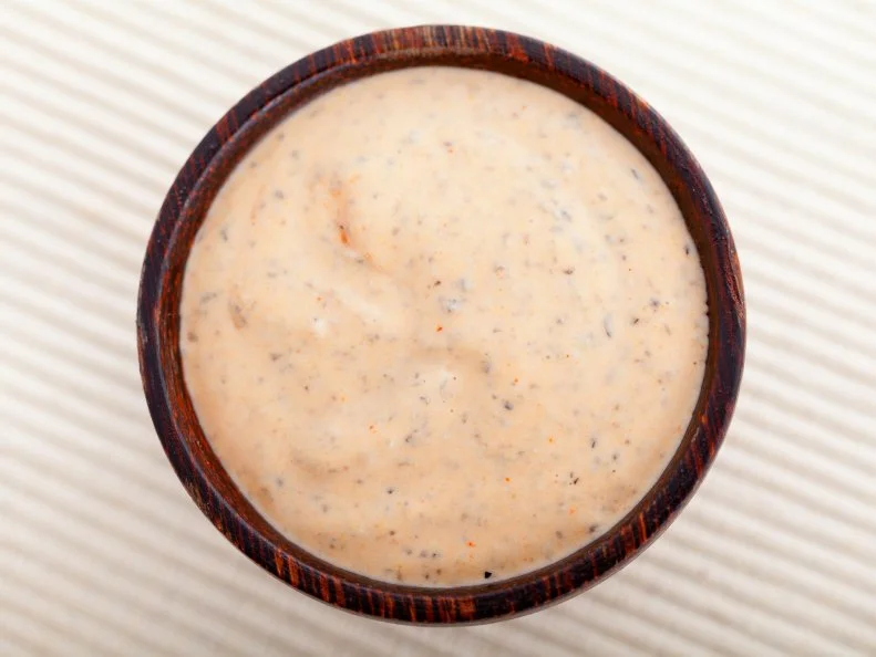 This spicy, creamy concoction — a cross between Thousand Island dressing and remoulade — is a menu mainstay at restaurants across the state, as a salad dressing and a dipping sauce for everything from fried green tomatoes to crab cakes. Most recipes call for a combination of mayonnaise, chile sauce, ketchup, Worcestershire, grated onion, garlic and often a hit of Tabasco. It was born in the 1920s at the Rotisserie, a now defunct Greek restaurant in Jackson, which set out to create a sauce so tantalizing customers would “come back” for more. The Mayflower Cafe, another Greek seafood restaurant that’s been a fixture in Jackson’s downtown since 1935, serves their own interpretation in the old-school dining room and sells it by the bottle as well. Cat Cora slathered it on everything growing up in Jackson’s Greek community, and once featured it on The Best Thing I Ever Ate.