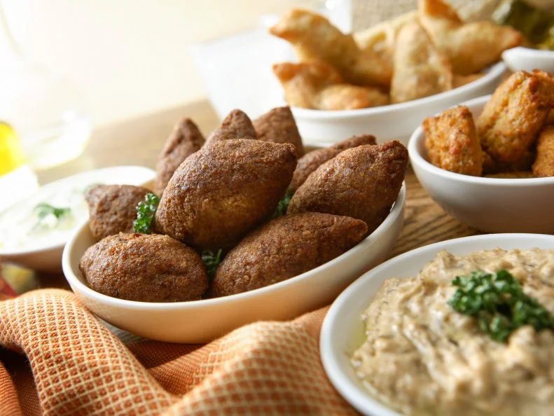 Lebanese immigrants settled in the Mississippi Delta in the late 1800s, first as peddlers and later as shop owners and restaurateurs. The Rest Haven, an old Clarksdale diner, offers a taste of both worlds, with a menu featuring Southern classics alongside Middle Eastern mainstays — most notably kibbe, sometimes called Lebanon’s national dish. Made of ground beef, cracked wheat, onion and spices, kibbe may be formed into patties and served raw, stuffed with pine nuts and baked, stuffed into grape leaves or shaped into mini torpedoes and deep-fried like croquettes. At the Rest Haven, you can order it Lebanese-style with hummus or tabouli, or local-style, with black-eyed peas and turnip greens.