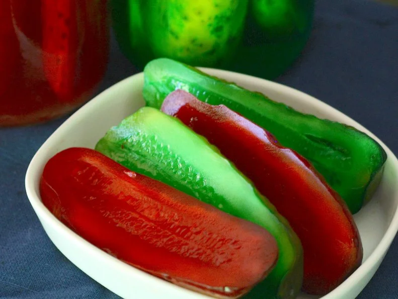 The Kool-Aid Pickle — sometimes called a “Koolickle” — is a Mississippi Delta creation gone viral. Decades ago, kids bought jumbo dills from the convenience store and sprinkled them with dry Kool-Aid for extra zing. A store owner started brining the dills in Kool-Aid and sugar to sell and now you can find these laughably colorful cukes, which people either love or hate, floating in giant mayonnaise jars on counters throughout the Delta, especially at Double Quick convenience stores. Walmart now sells their version, the Tropickle: pickle spears infused with fruit punch powdered drink mix. Those who love them can also make them at home.